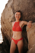 Red crochet halter bikini set with openwork lace pattern, high-neck top and tie-side bottom — handmade swimwear